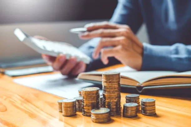 Business owner preparing documents for invoice factoring approval