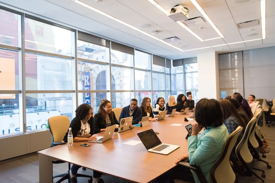 Staffing team collaborating on payroll and funding solutions